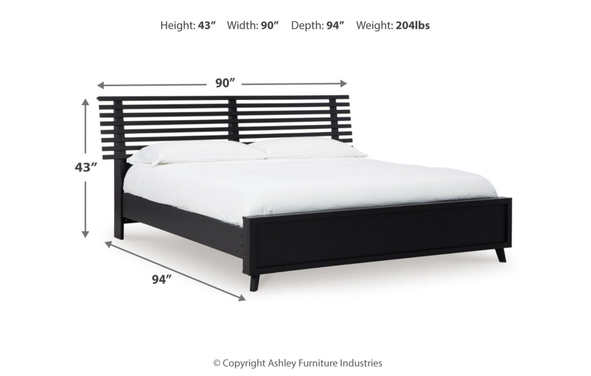 Danziar King Panel Bed with Mirrored Dresser