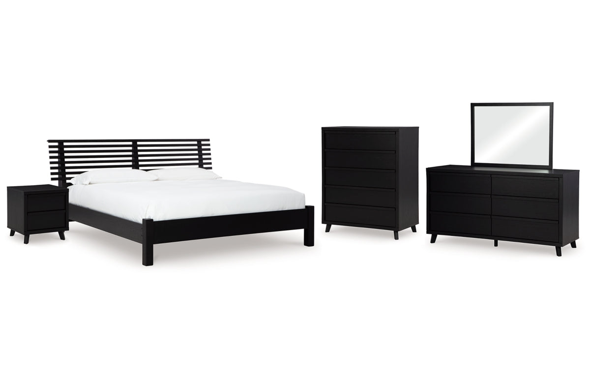 Danziar Queen Panel Bed with Mirrored Dresser, Chest and Nightstand