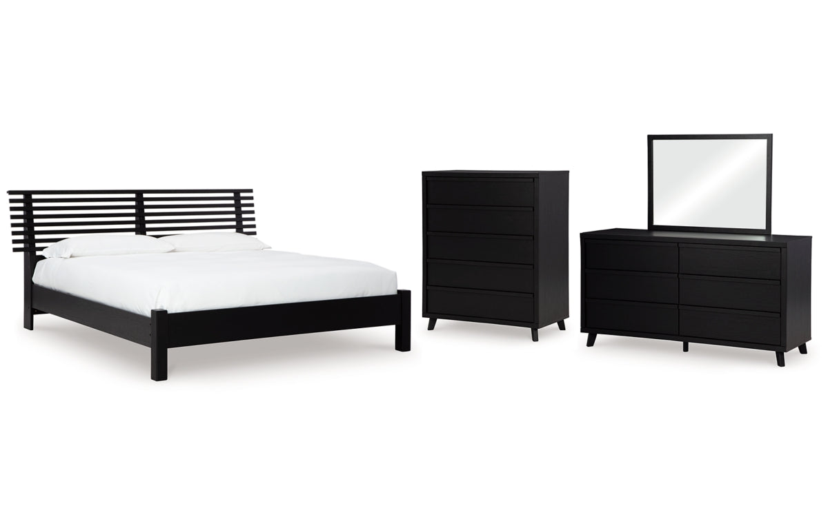 Danziar Queen Panel Bed with Mirrored Dresser and Chest