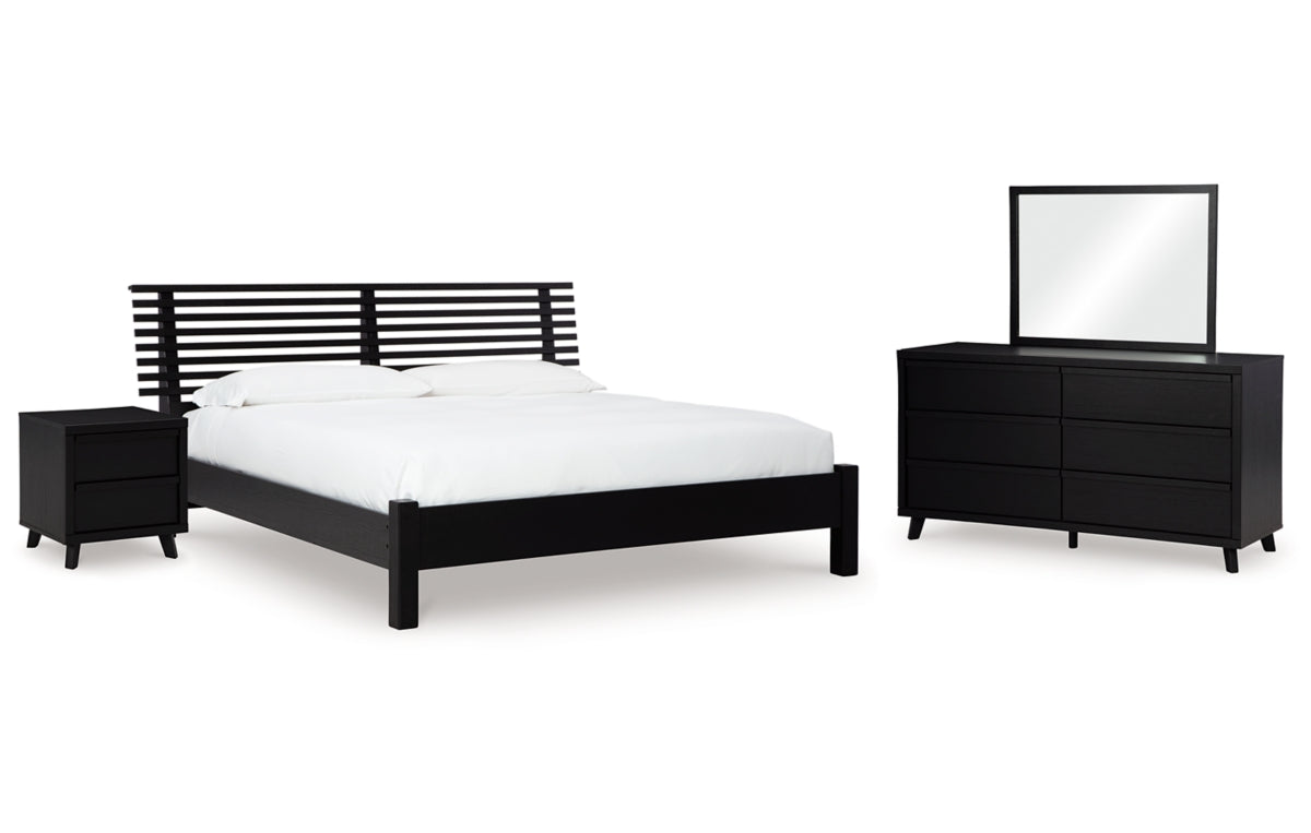 Danziar King Panel Bed with Mirrored Dresser and Nightstand