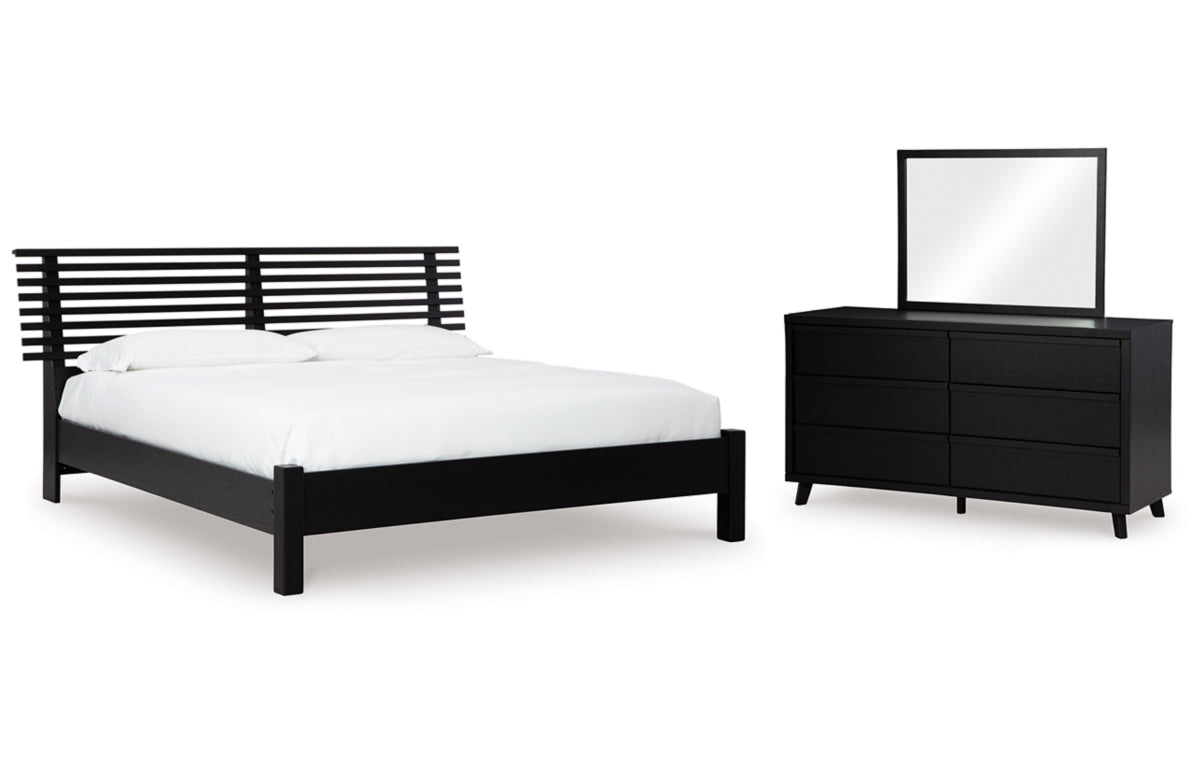 Danziar Queen Panel Bed with Mirrored Dresser