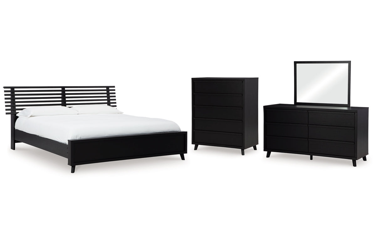 Danziar King Panel Bed with Mirrored Dresser and Chest