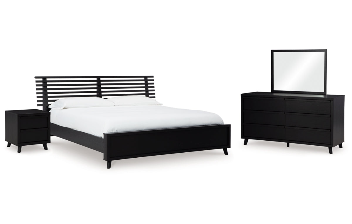 Danziar King Panel Bed with Mirrored Dresser and Nightstand