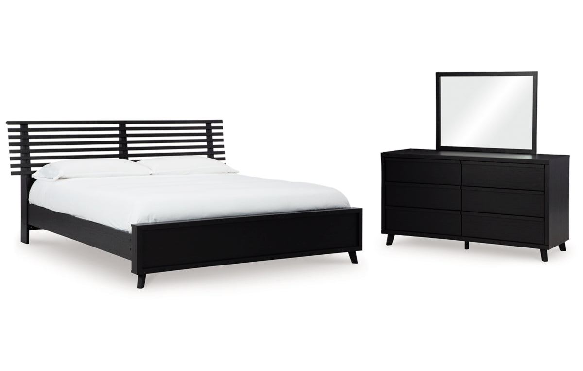 Danziar King Panel Bed with Mirrored Dresser