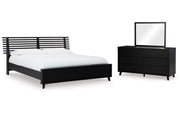 Danziar King Panel Bed with Mirrored Dresser