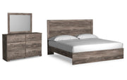 Ralinksi King Panel Bed with Mirrored Dresser