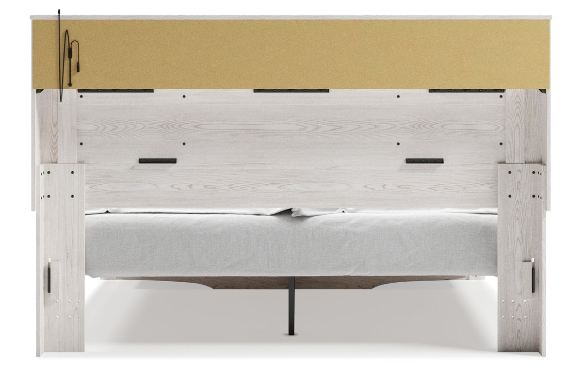 Altyra King Upholstered Bookcase Bed with Storage