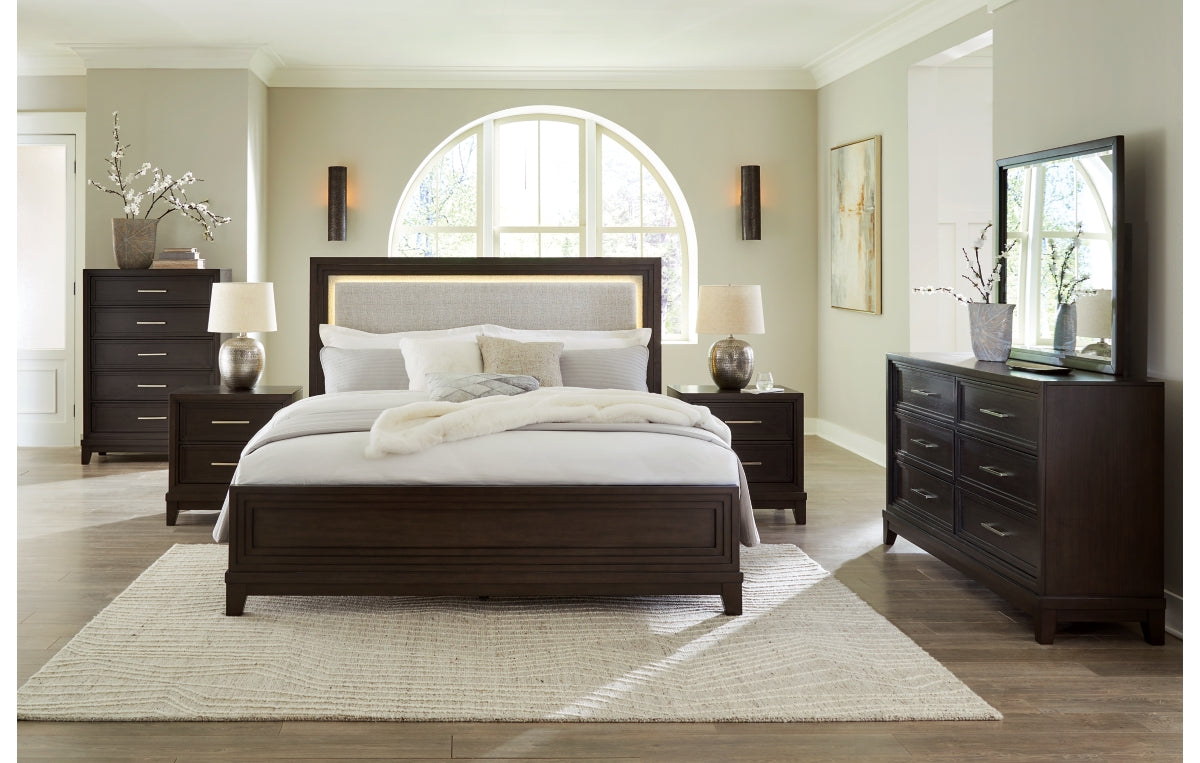 Neymorton California King Upholstered Panel Bed with Mirrored Dresser and Nightstand