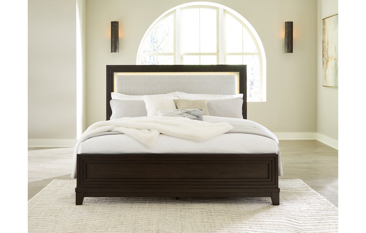 Neymorton California King Upholstered Panel Bed with Mirrored Dresser and Chest