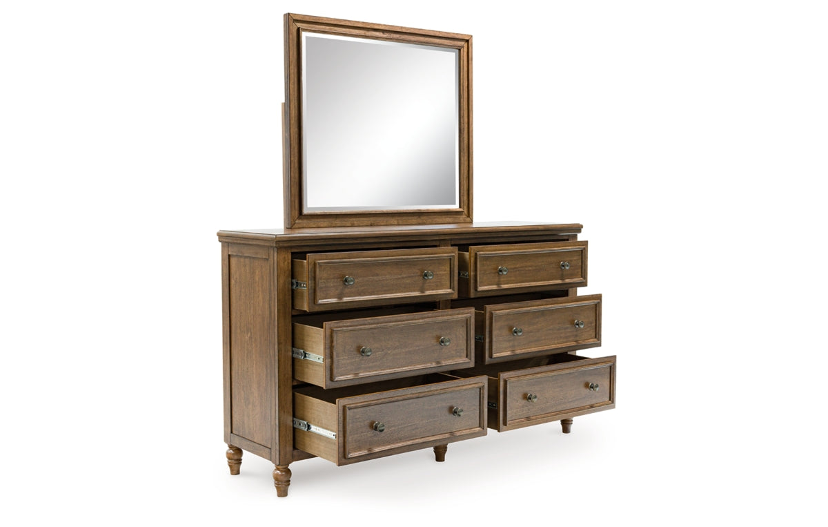 Sturlayne California King Upholstered Panel Bed, Dresser, Mirror and Chest