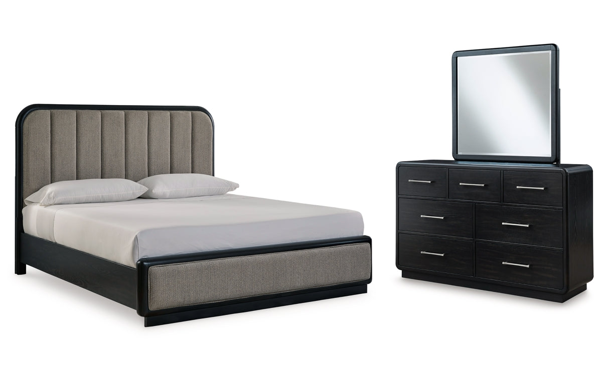 Rowanbeck California King Upholstered Panel Bed with Mirrored Dresser