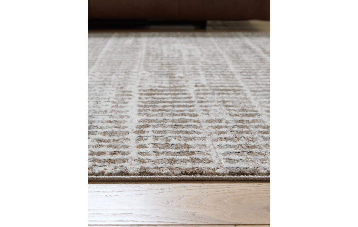 Fuadwick 5'3" x 7' Area Rug