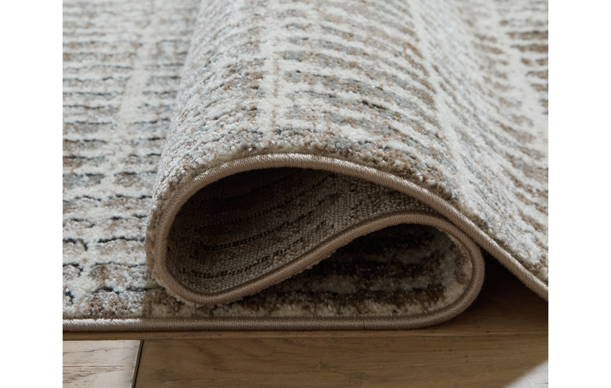 Fuadwick 5'3" x 7' Area Rug