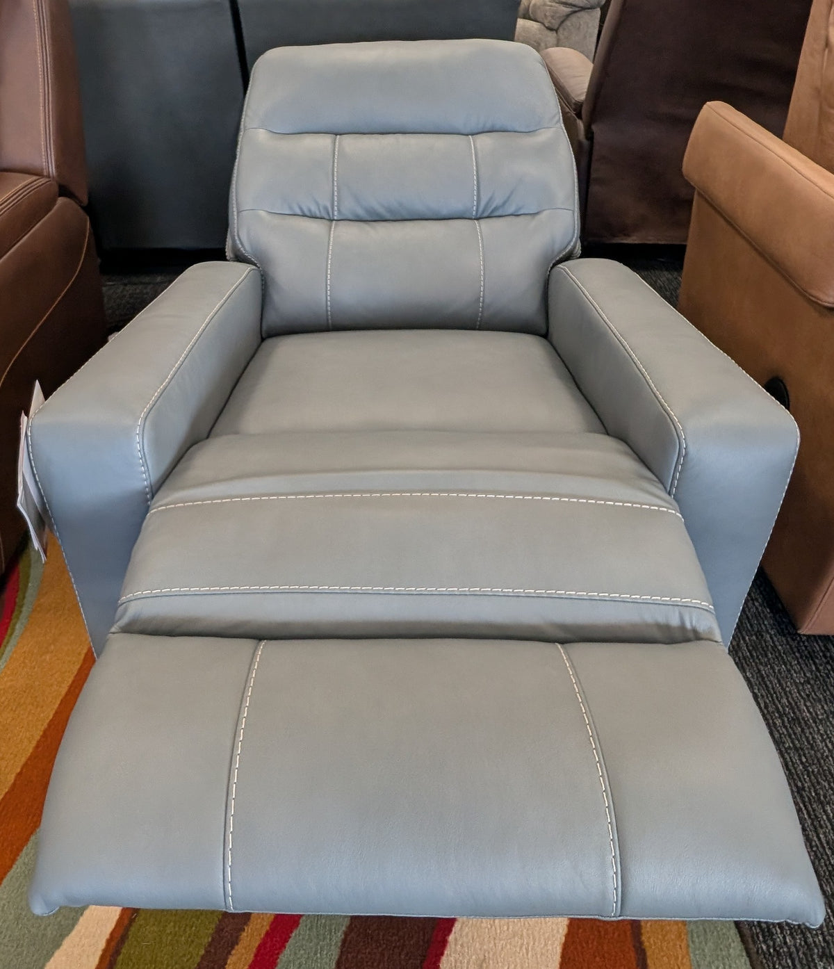 Power recliner with adjustable headrest