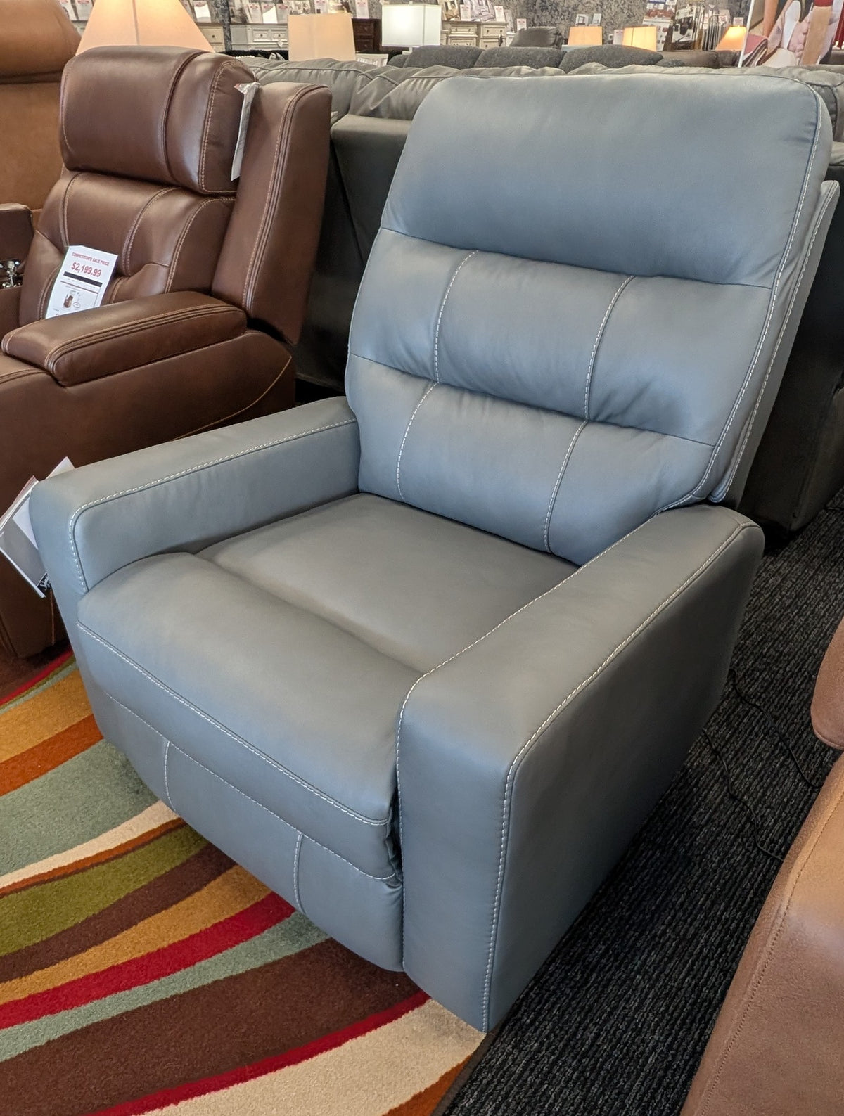 Power recliner with adjustable headrest