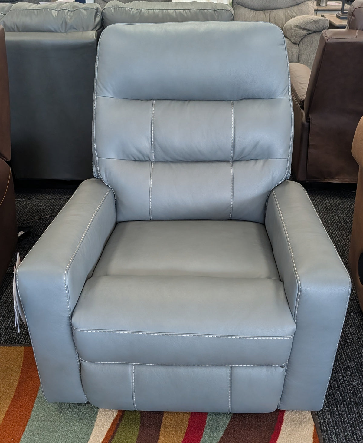 Power recliner with adjustable headrest